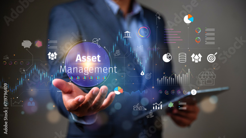 Asset management concept, Businessman Holding asset management and Icon  on virtual display. Financial Property Digital assets.