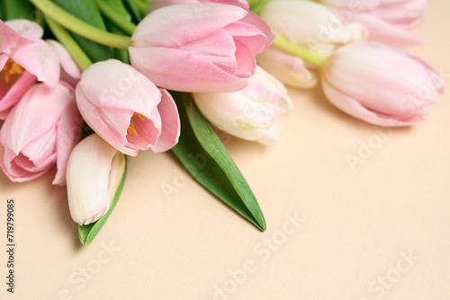 Bouquet of beautiful tulips on yellow background. International Women's Day