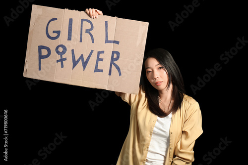 Wallpaper Mural Beautiful young Asian woman holding paper with text GIRL POWER on black background. Women history month Torontodigital.ca