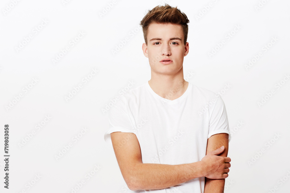 Portrait, fashion and relax with casual man in studio isolated on white background for classic style. Model, clothes and serious with confident young person in t-shirt or clothing outfit on mockup Portrait, fashion and relax with casual man in studio isolated on white background for classic style. Model, clothes and serious with confident young person in t-shirt or clothing outfit on mockup