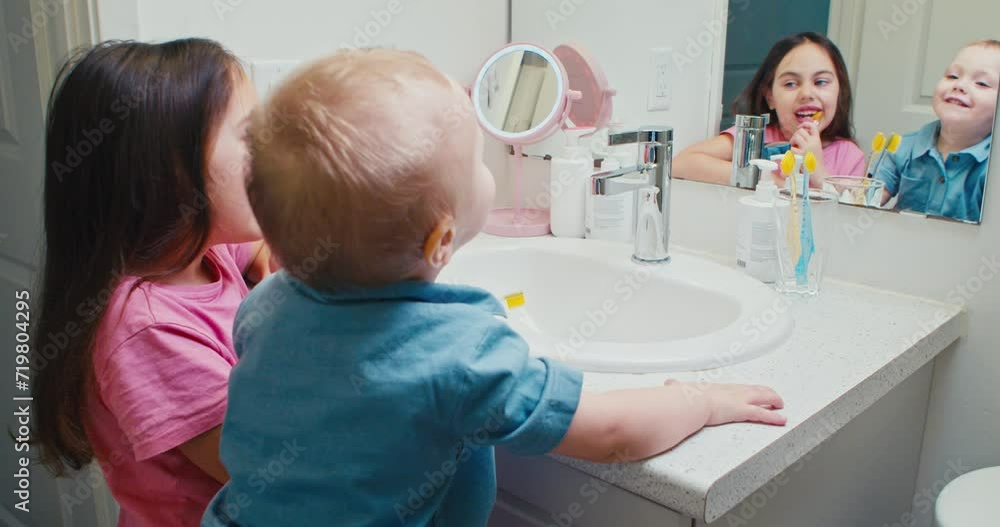 Happy family Children brother and sister brushing their teeth in the bathroom. Happy family Children brother and sister brushing their teeth in the bathroom.