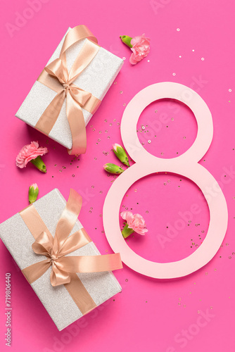 Figure 8 with gift boxes and beautiful flowers on pink background. International Women's Day