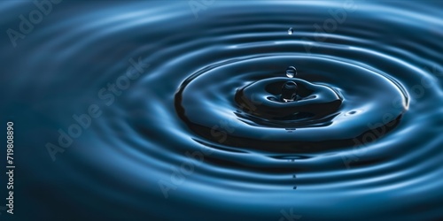 Water droplet creating ripples on a surface