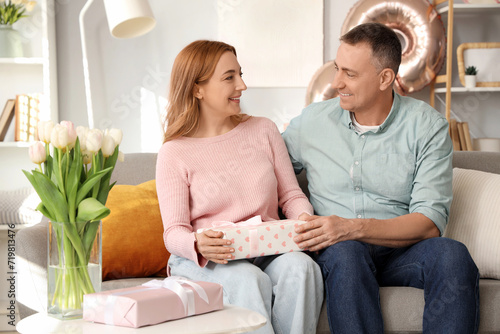 Middle-aged couple with gif...