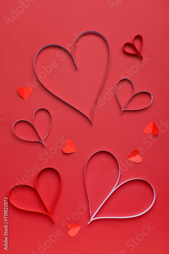 Composition with paper hearts for Valentine s Day celebration on red background