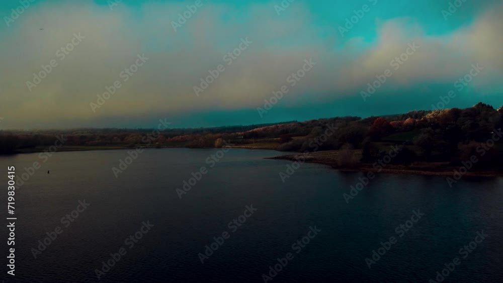 Aerial view 4k birds eye view of Rutland water in Rutland England UK. Clear blue skies on a cold day with clear waters and water fowl. Aerial view 4k birds eye view of Rutland water in Rutland England UK. Clear blue skies on a cold day with clear waters and water fowl.
