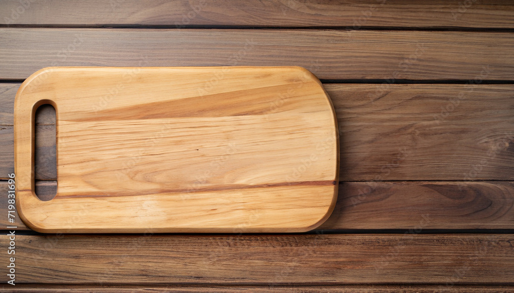 Culinary essentials: Cooking wooden board on wood table table. Flat lay with copy space Culinary essentials: Cooking wooden board on wood table table. Flat lay with copy space