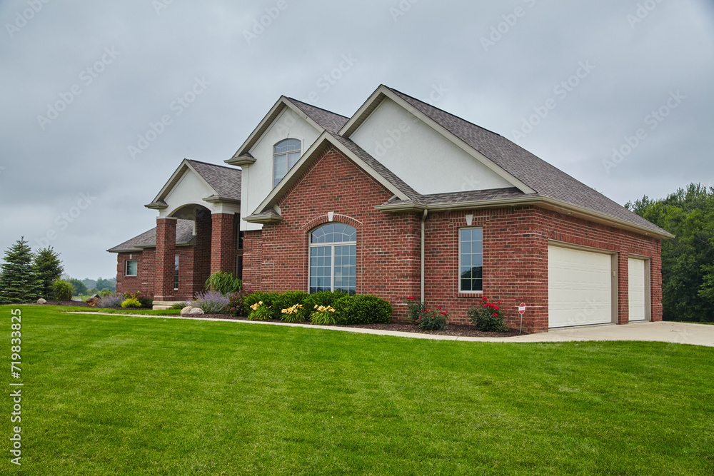 Elegant Suburban Red Brick Home with Landscaped Lawn, Eye-Level View