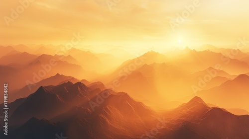 Golden sunrise illuminating the misty mountains.