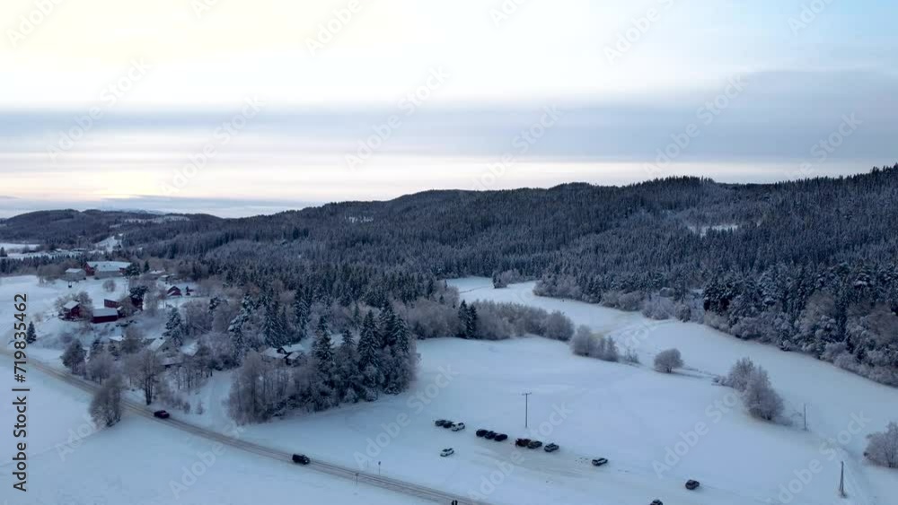 Traverse the enchanting snow-laden forest, where every tree branch is delicately adorned with a pristine layer of snow, creating a magical atmosphere that transports you to a realm of tranquility.