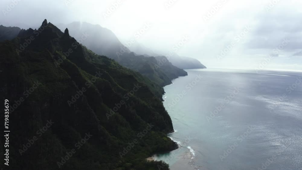 Aerial view along the steep coastline and the sea, foggy day in Hawaii, USA Aerial view along the steep coastline and the sea, foggy day in Hawaii, USA