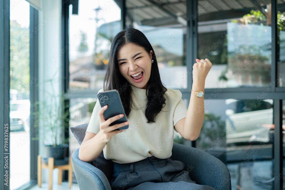 Video call. Young Asian woman communicating on long-distance online video. looking digital smartphone screen Happy talking with friends happily