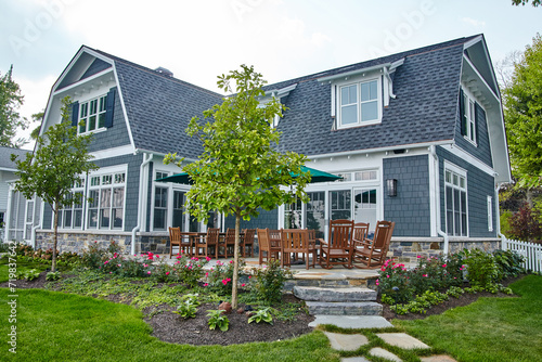 Modern Craftsman Home with Manicured Garden and Patio Set