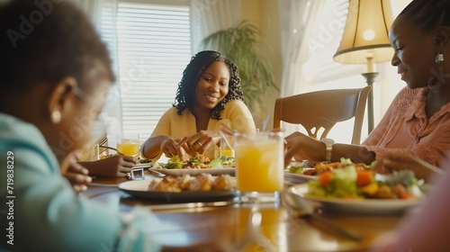 Happy African American family eating lunch together at dining table. Focus is on mother serving food. : Generative AI