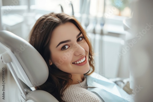 A happy woman is sitting in a dentist's chair and looking directly at the camera. Capture the positive atmosphere and her contentment during the dental visit