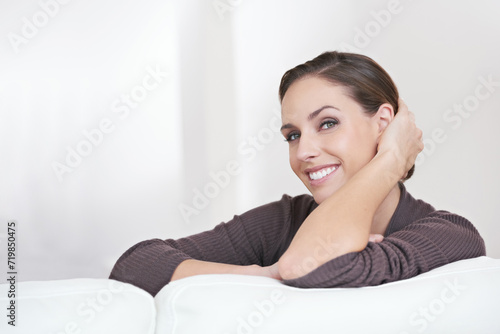 Woman, resting and portrait in living room sofa for positive, satisfaction and mindset. Happiness, calm and weekend with female person, home and joy, carefree and comfortable alone in couch to relax