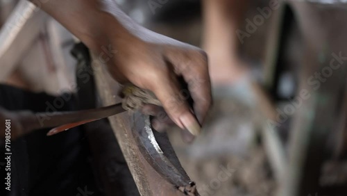 someone's hand was sanding a knife