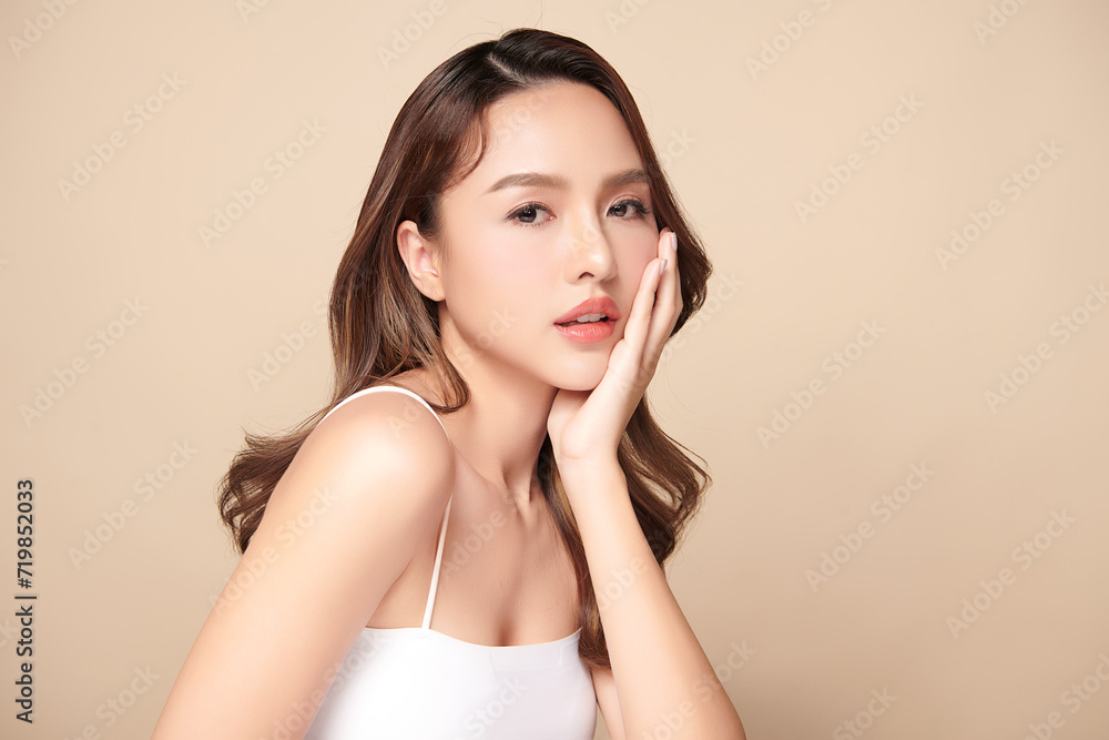 Beautiful young asian woman with clean fresh skin on beige background, Face care, Facial treatment, Cosmetology, beauty and spa, Asian women portrait. Beautiful young asian woman with clean fresh skin on beige background, Face care, Facial treatment, Cosmetology, beauty and spa, Asian women portrait.