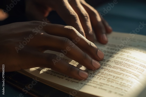 Close-up Hand with braille letters, blind man's hand with reading book 