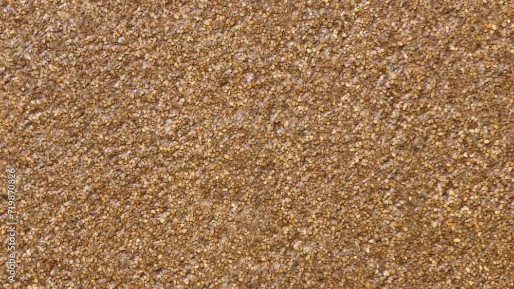 Water running down brown textured stone or concrete. Full frame abstract texture background. Water running down brown textured stone or concrete. Full frame abstract texture background.