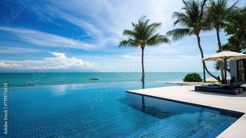 beachside swimming pool concept © saka