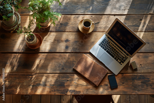 laptop tablet notebook and pensil on Vintage Wooden teble in garden coffee shop photo