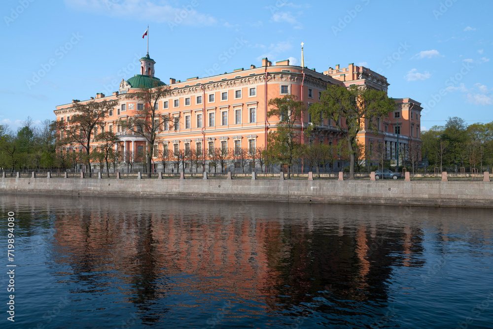View of the ancient Engineer's Castle from the embankment of the Fontanka river on a sunny May morning. Saint-Petersburg, Russia