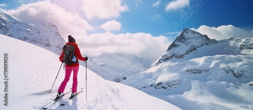 a woman ice skiing in the snow mountains © saka