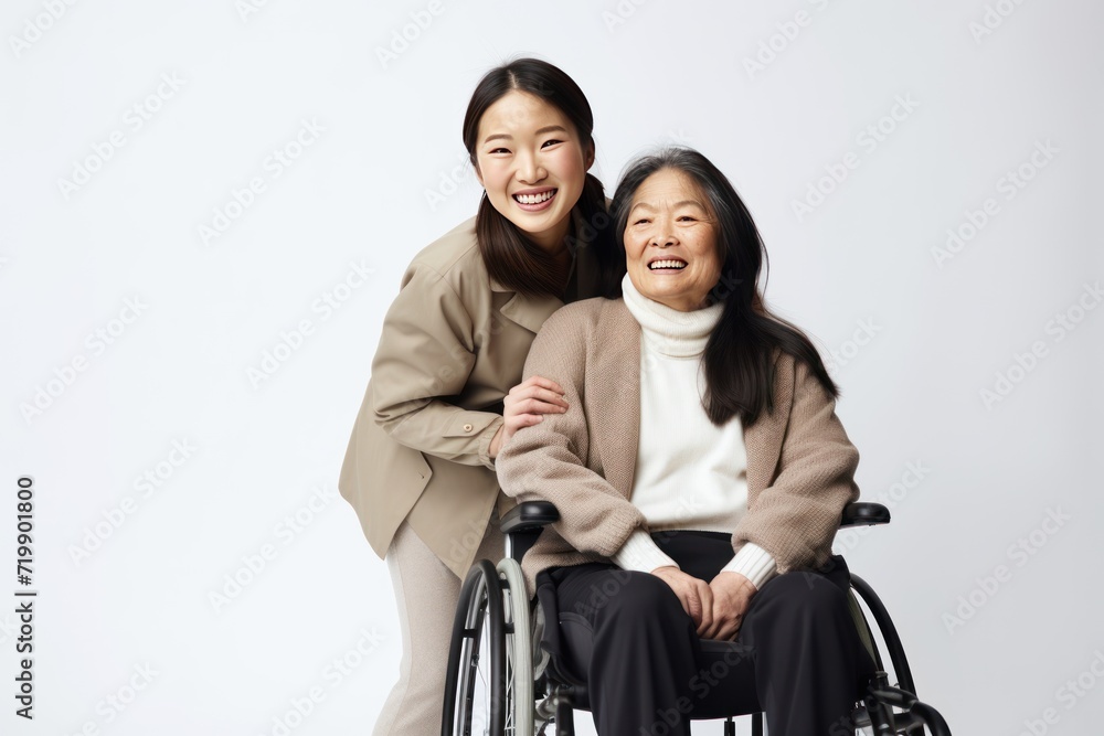 young asian with happy smiling woman in a wheelchair on white background, young asian with happy smiling woman in a wheelchair on white background,