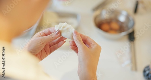 Japan  hands and dumplings in kitchen for dinner  brunch and traditional meal in restaurant or cafe. Culture  gyozo and asian cuisine for nutrition  healthy diet and lunch with preparation or pastry