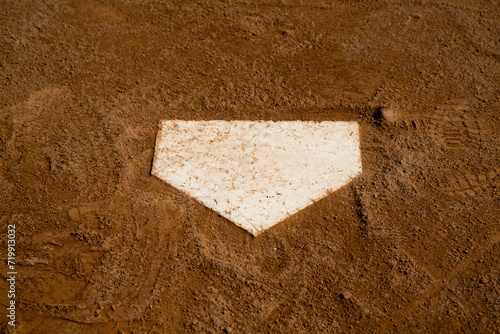 red clay baseball field and various views of the baseball home plate