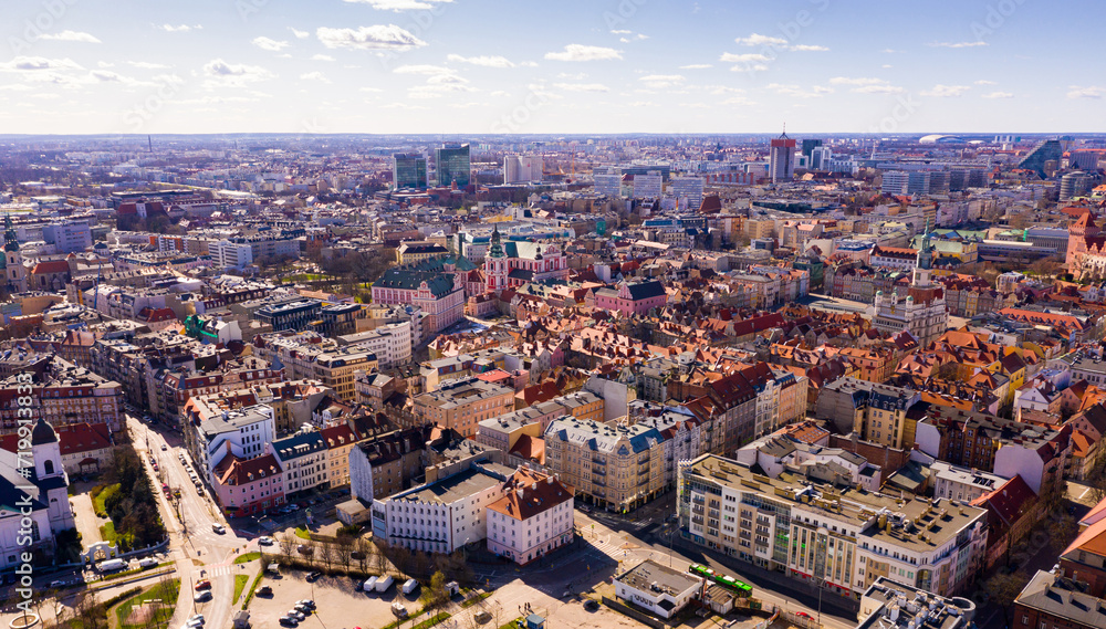 Aerial view of Poznan modern cityscape overlooking new residential areas and historical center on sunny spring day, Poland