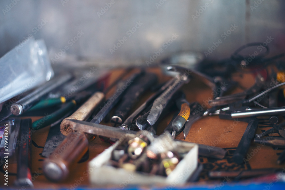 Fototapeta premium Mechanic tools engineering equipment car auto repair shop with copy space. Blurred background mechanical service. Heavy screw grungy rusted wrenches dirty screwdriver object. Industrial hardware set