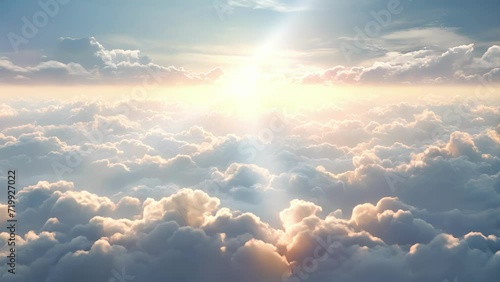 Dense lumpy mounds of fluffy clouds illuminated by bright sunbeams