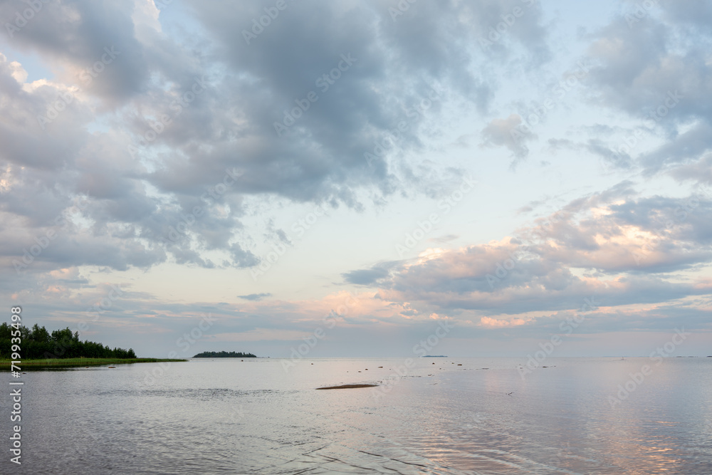 Moody summer evening by the sea with beautiful clouds in the sky, Bothnian Bay, Baltic Sea, Finland