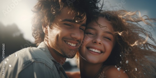 A heartwarming moment captured on the beach, where a man and a woman are hugging each other. This picture can be used to depict love, romance, relationships, or vacation memories