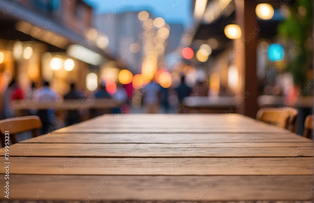 An empty wooden table on the background of street food courts, bokeh defocused background