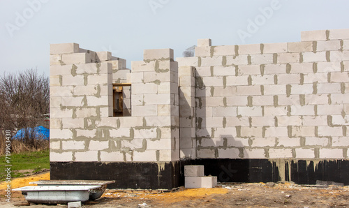 Fototapeta Naklejka Na Ścianę i Meble -  Bricks in the walls of a new unfinished house