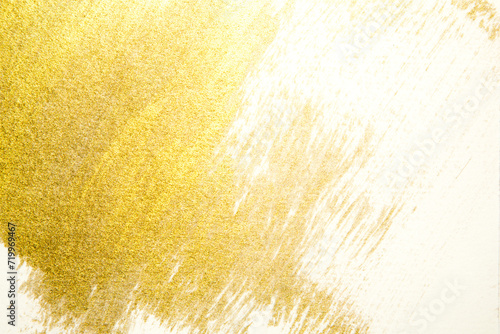 gold paint splatter on a white background