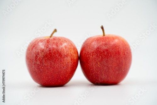 Red apples close up on white background isolated.