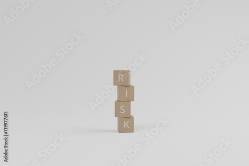 Wooden blocks with the word Risk stacked up irregularly. Investment and business concept. 3d rendering © Ekkachai