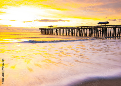Sunrise and Wooden Pier on Fernandina Beach, Amelia Island, Florida, USA