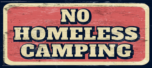 Aged and worn no homeless camping sign on wood