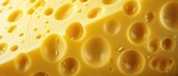 A textured background featuring fresh yellow cheese with prominent holes, Ai Generated.