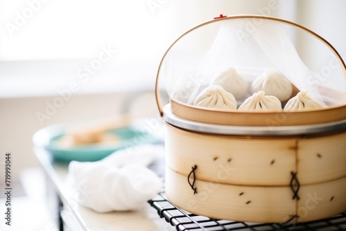 baozi steamed buns in a steamer basket