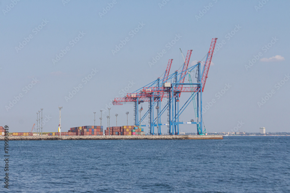 Port cargo crane and container ship in harbor of Odesa, Ukraine