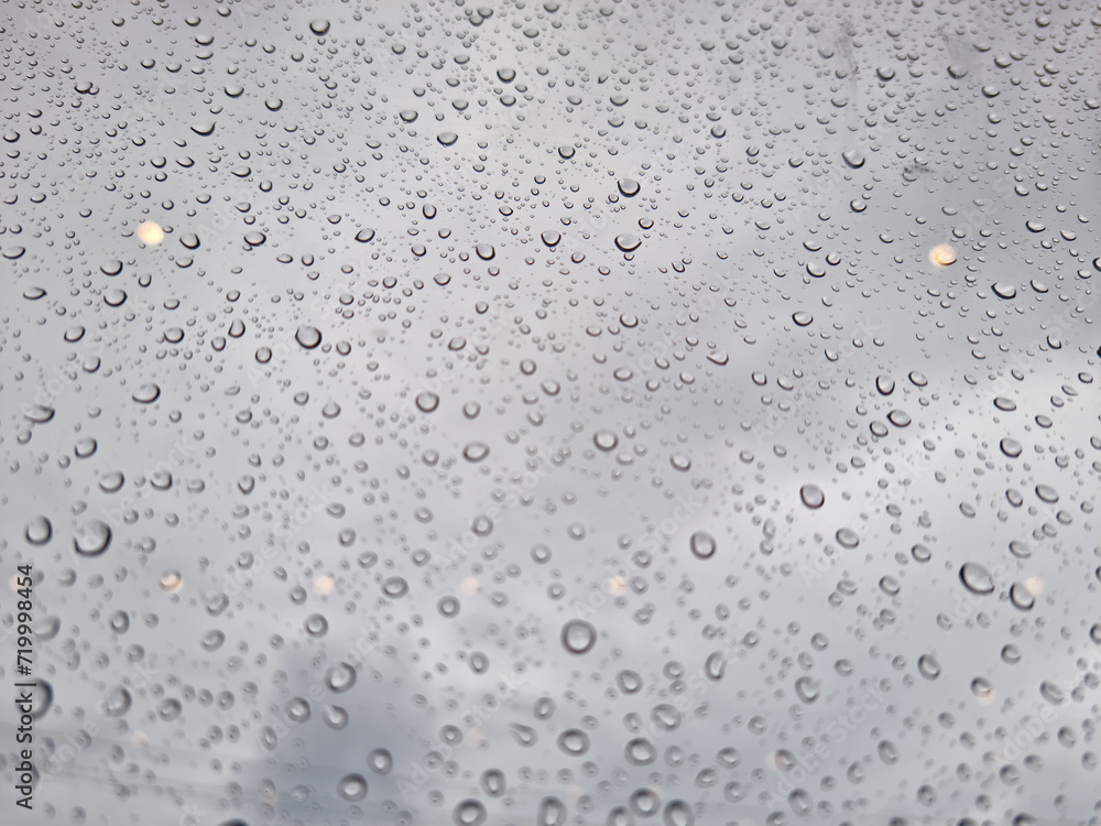 Close-up of water droplets forming on the window. Close-up of water droplets forming on the window.