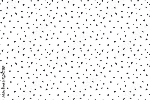 Dash pattern on white background. Wrapping paper with small black dots painted with a brush. Seamless simple minimal ornament. Abstract geometric grunge vector texture painted by ink photo