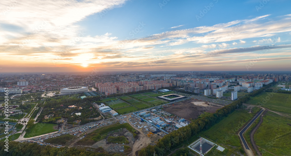 Krasnodar, Russia. Panorama of the city in summer. Park in the city of Krasnodar. Football grounds. Sunset. Aerial view