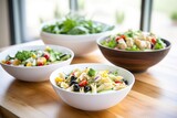 cold pasta salads with vegetables in large bowls